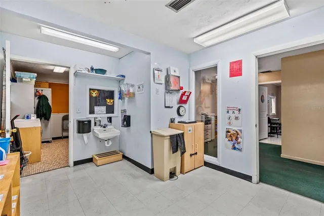 a living room with lots of furniture and a wooden floors