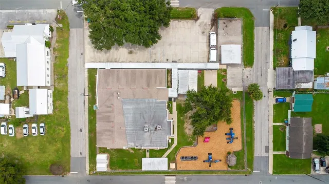 an aerial view of residential houses with outdoor space