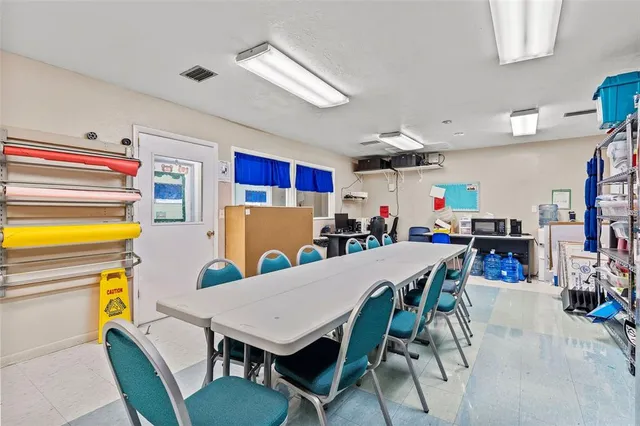 a white toilet sitting next to a bathroom sink and a shower