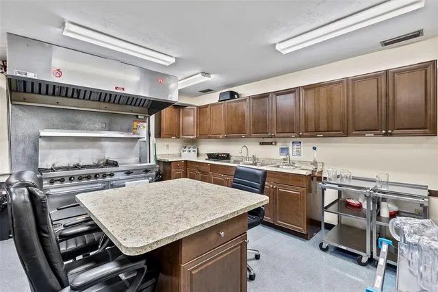 a dining room with a table and chairs