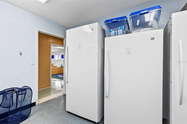 a view of a hallway with wooden floor and closet