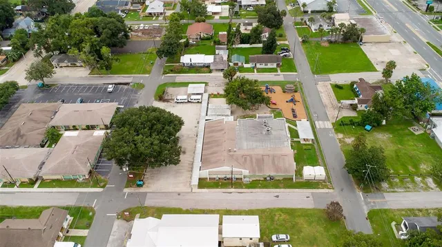 a view of a porch with chairs and floor to ceiling window