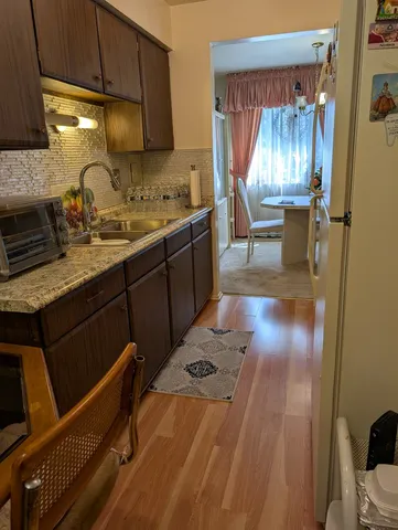 a kitchen with a sink and a refrigerator
