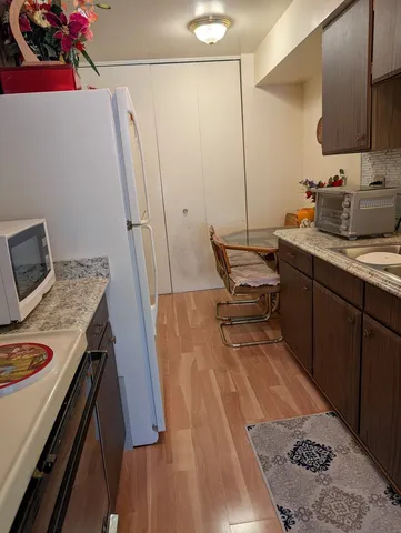 a kitchen with sink cabinets and stove