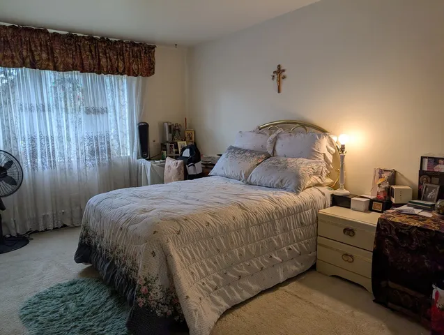 a bedroom with a bed and a cabinets