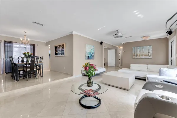 a view of a livingroom with furniture and a chandelier