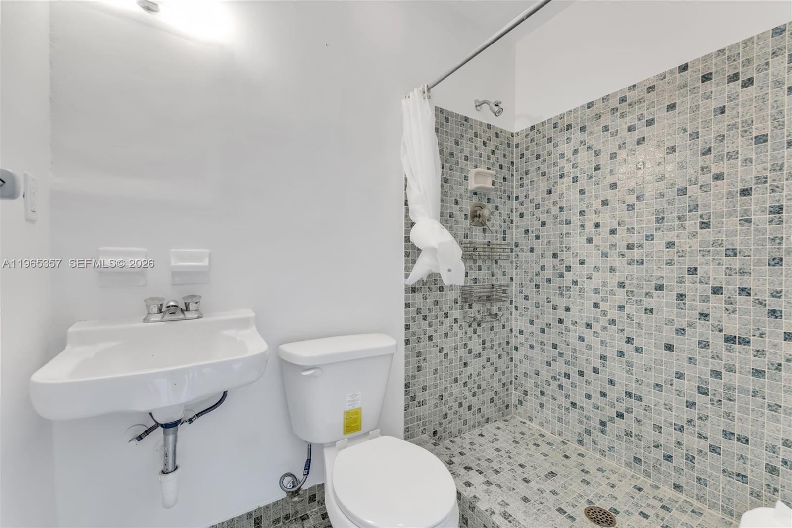 11201 Southwest 136th Street Miami, FL 33176 - Photo 30 of 40 a bathroom with a toilet sink and mirror