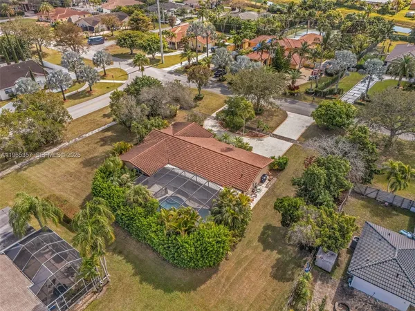 an aerial view of residential houses with outdoor space