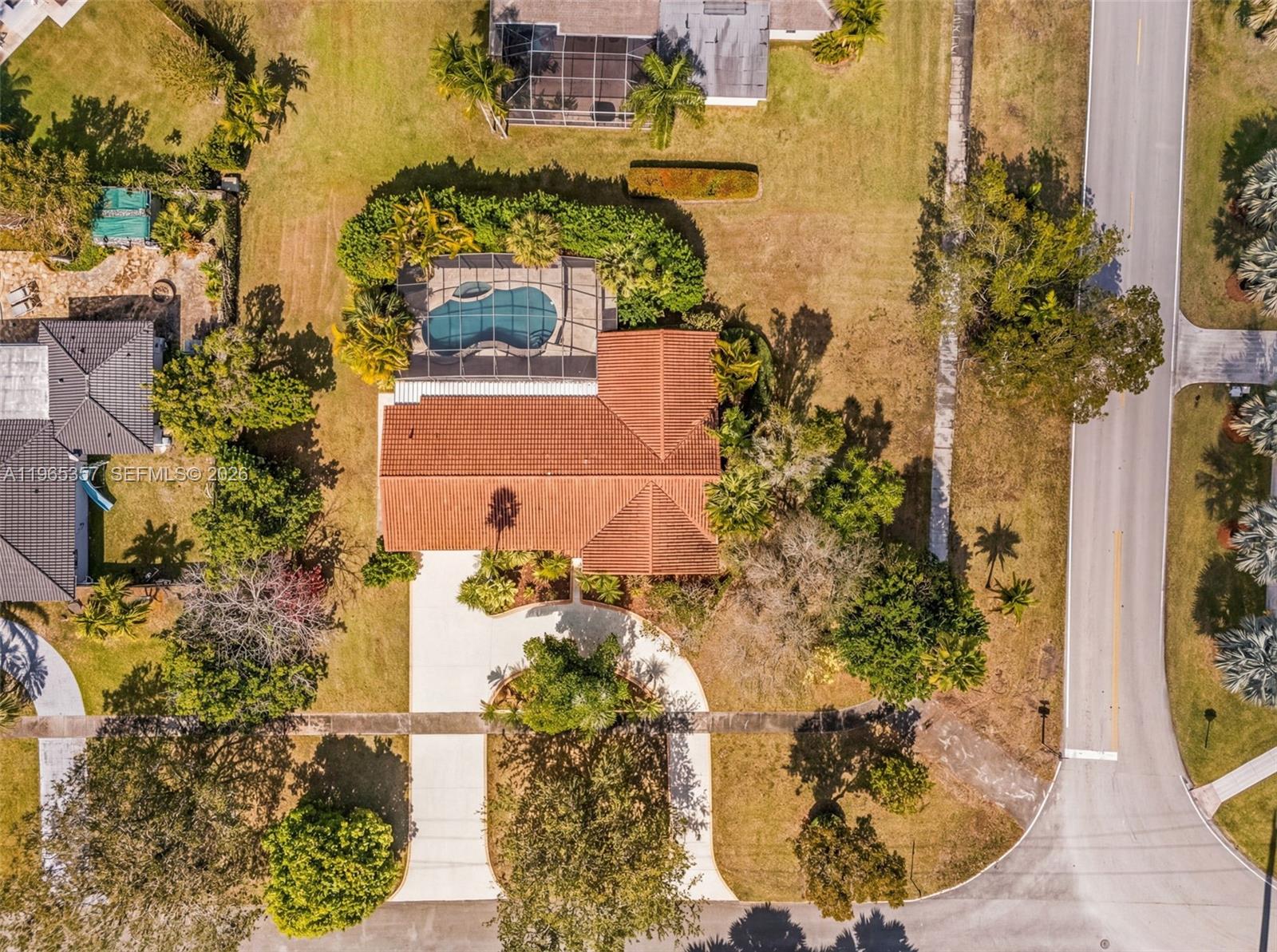 11201 Southwest 136th Street Miami, FL 33176 - Photo 39 of 40 aerial view of a house with a yard and lake view