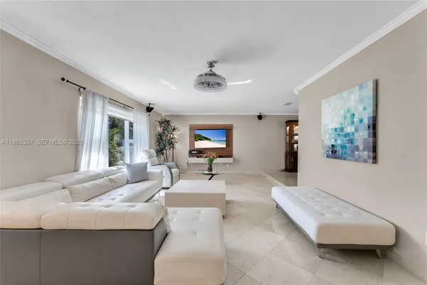 a living room with furniture and a window