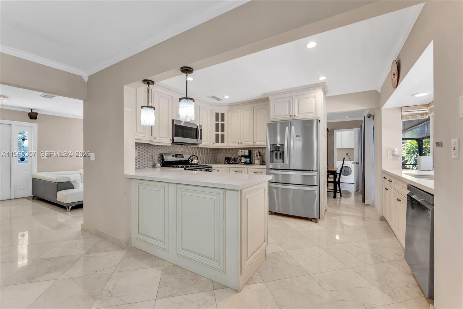 11201 Southwest 136th Street Miami, FL 33176 - Photo 8 of 40 a kitchen with stainless steel appliances a refrigerator sink and stove