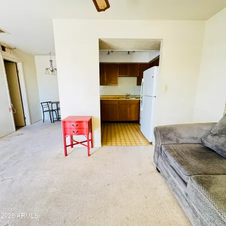 a bathroom with a granite countertop shower and a toilet