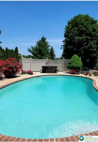 a view of a house with a big yard
