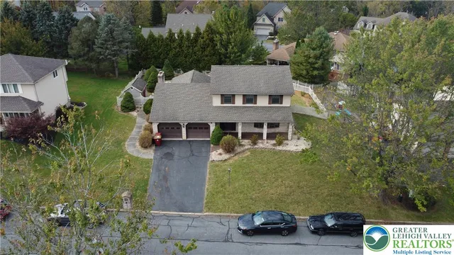 an aerial view of a house with a garden