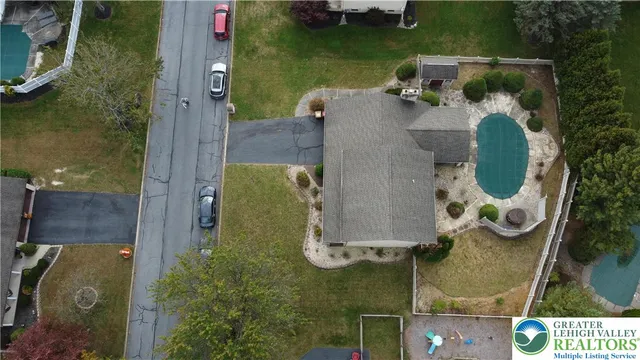 an aerial view of a house with outdoor space