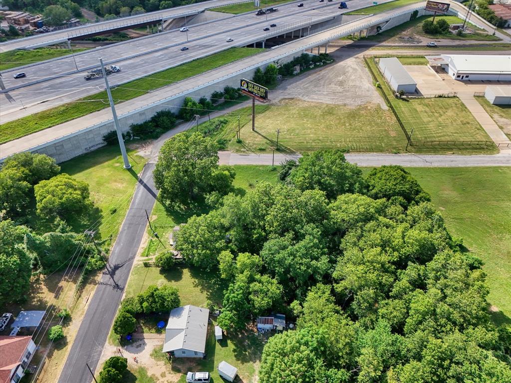 700-702 Spring Street Waco, TX 76704 - Photo 2 of 8 an aerial view of a house with a garden and lake view