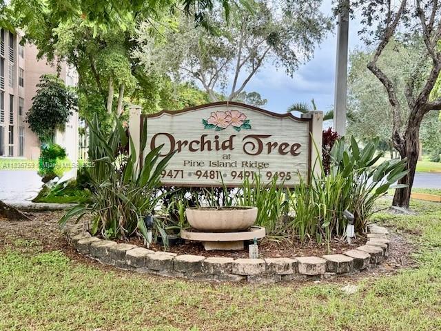 9491 Evergreen Place, Unit 102 Davie, FL 33324 - Photo 1 of 30 a sign that is sitting on a brick wall