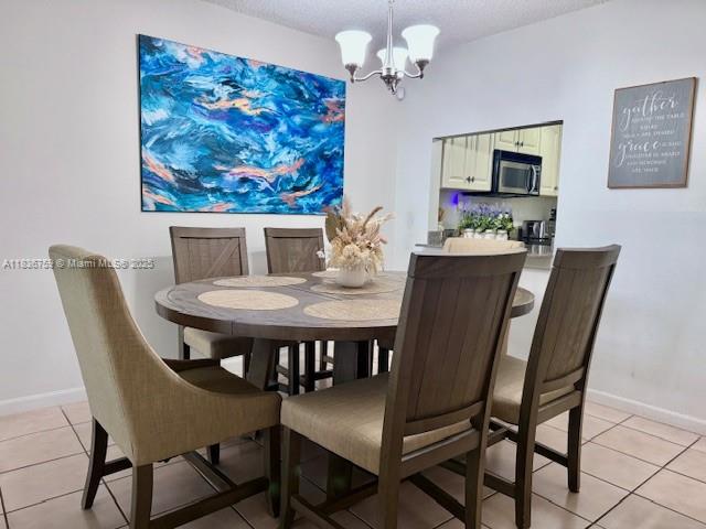 9491 Evergreen Place, Unit 102 Davie, FL 33324 - Photo 14 of 30 a view of a dining room with furniture