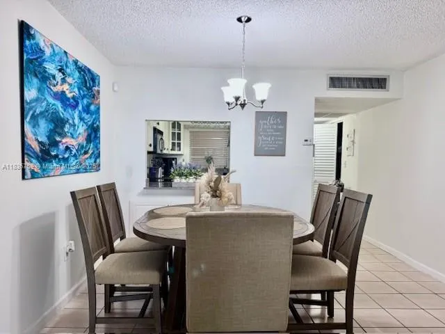 a kitchen with stainless steel appliances granite countertop a sink a stove and cabinets