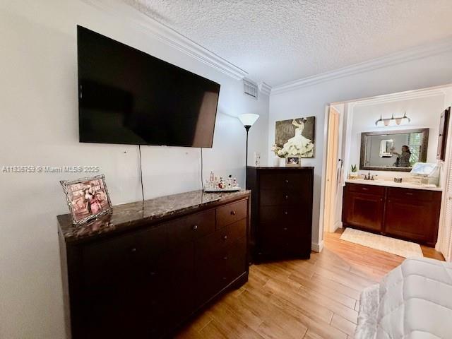 9491 Evergreen Place, Unit 102 Davie, FL 33324 - Photo 25 of 30 a living room with furniture and a flat screen tv
