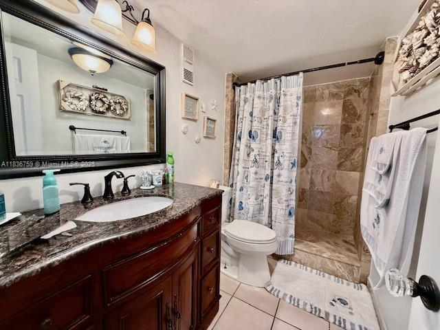 9491 Evergreen Place, Unit 102 Davie, FL 33324 - Photo 27 of 30 a bathroom with a granite countertop sink toilet and shower