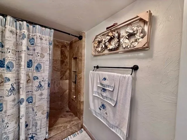 a bathroom with a sink mirror vanity and toilet