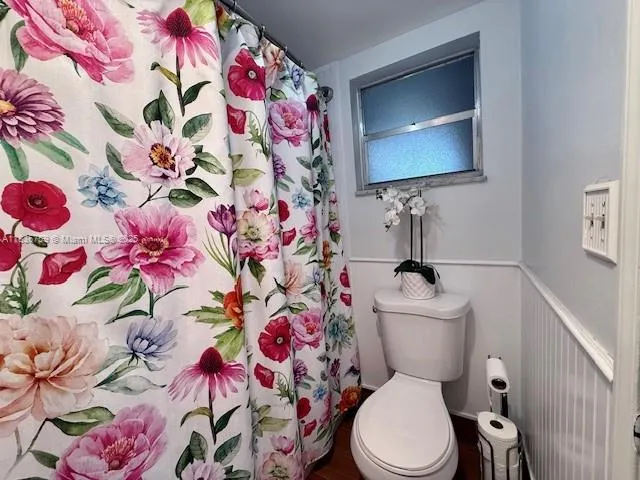 a view of a wooden door and a window