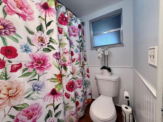9491 Evergreen Place, Unit 102 Davie, FL 33324 - Photo 29 of 30 a bathroom with a sink mirror vanity and toilet