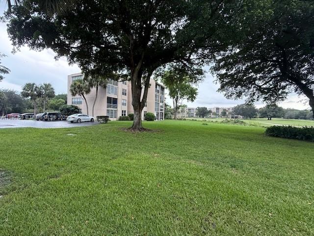 9491 Evergreen Place, Unit 102 Davie, FL 33324 - Photo 9 of 30 a view of a park with large trees