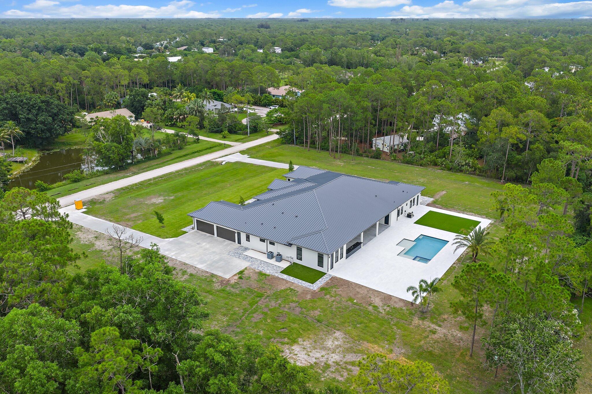 12850 152nd Street North Jupiter, FL 33478 - Photo 110 of 117 an aerial view of a house
