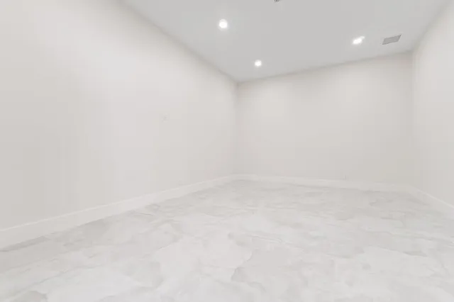 a room with a cabinets and white walls