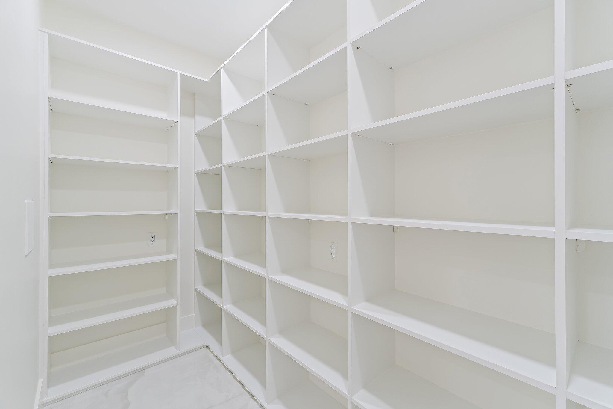 12850 152nd Street North Jupiter, FL 33478 - Photo 44 of 117 a view of walk in closet with empty racks