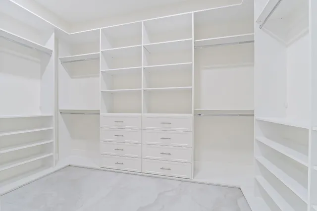 an aerial view of residential houses with outdoor space and swimming pool