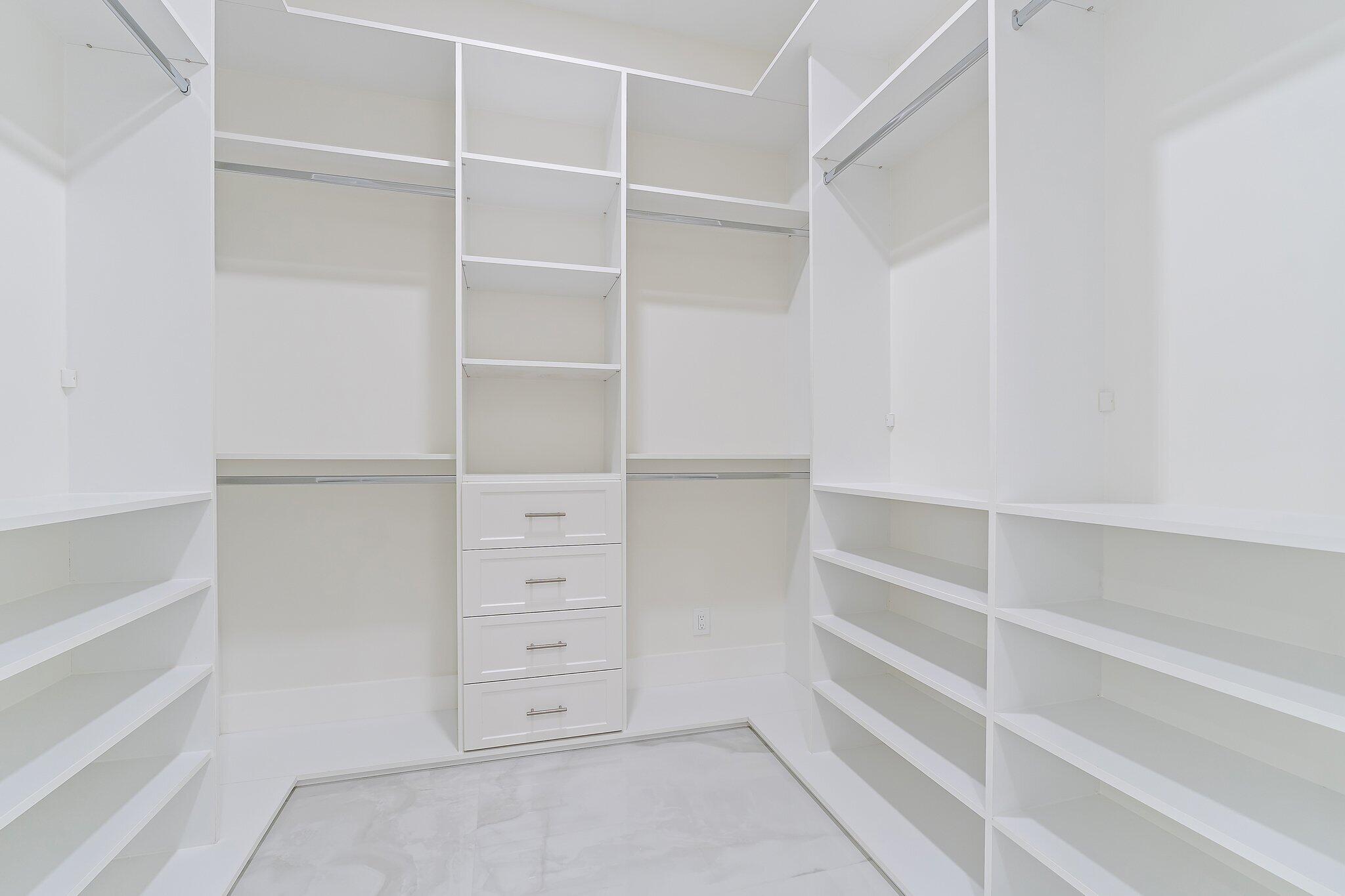 12850 152nd Street North Jupiter, FL 33478 - Photo 52 of 117 a view of walk in closet with empty racks