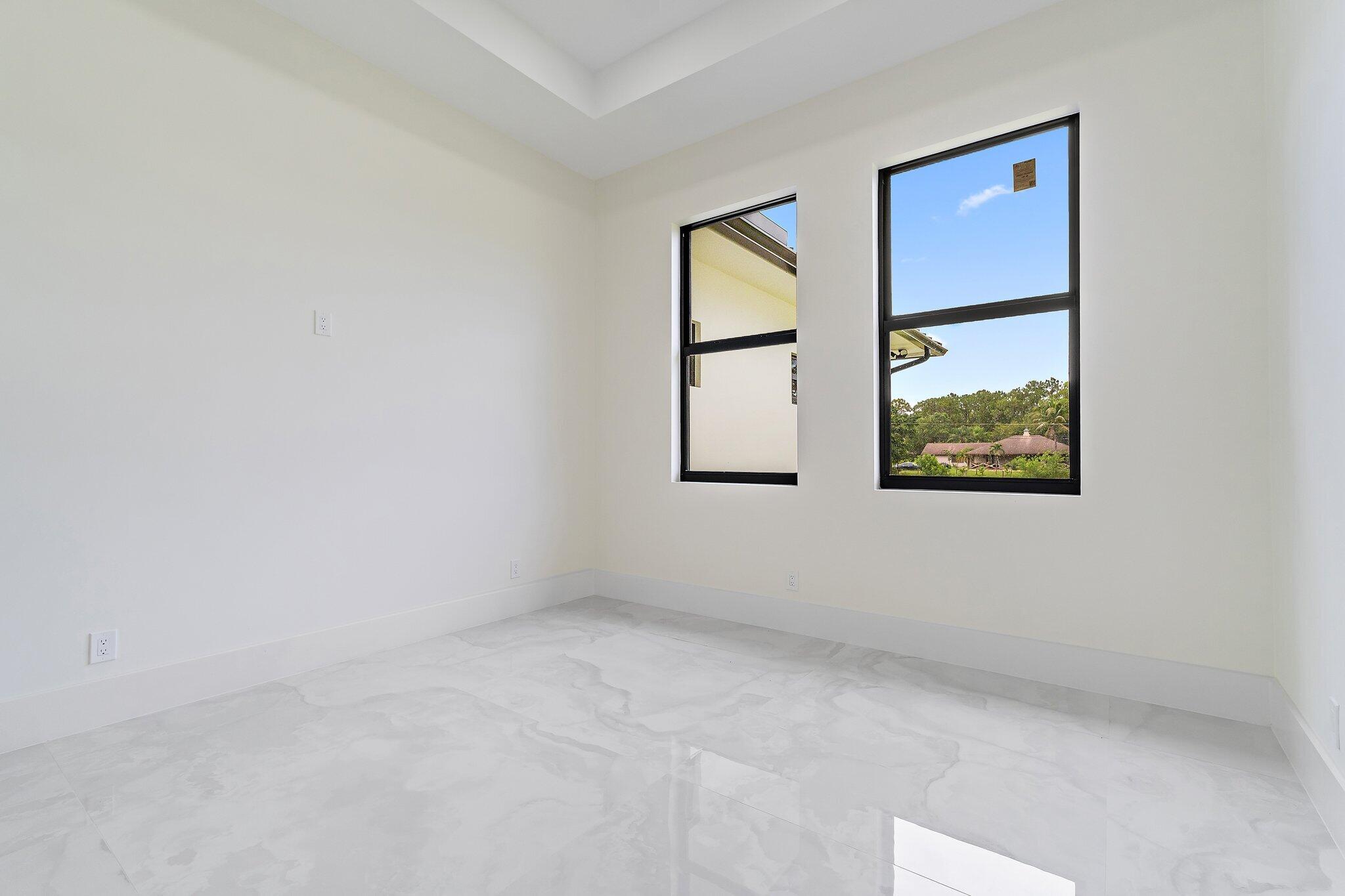 12850 152nd Street North Jupiter, FL 33478 - Photo 58 of 117 an empty room with windows and closet