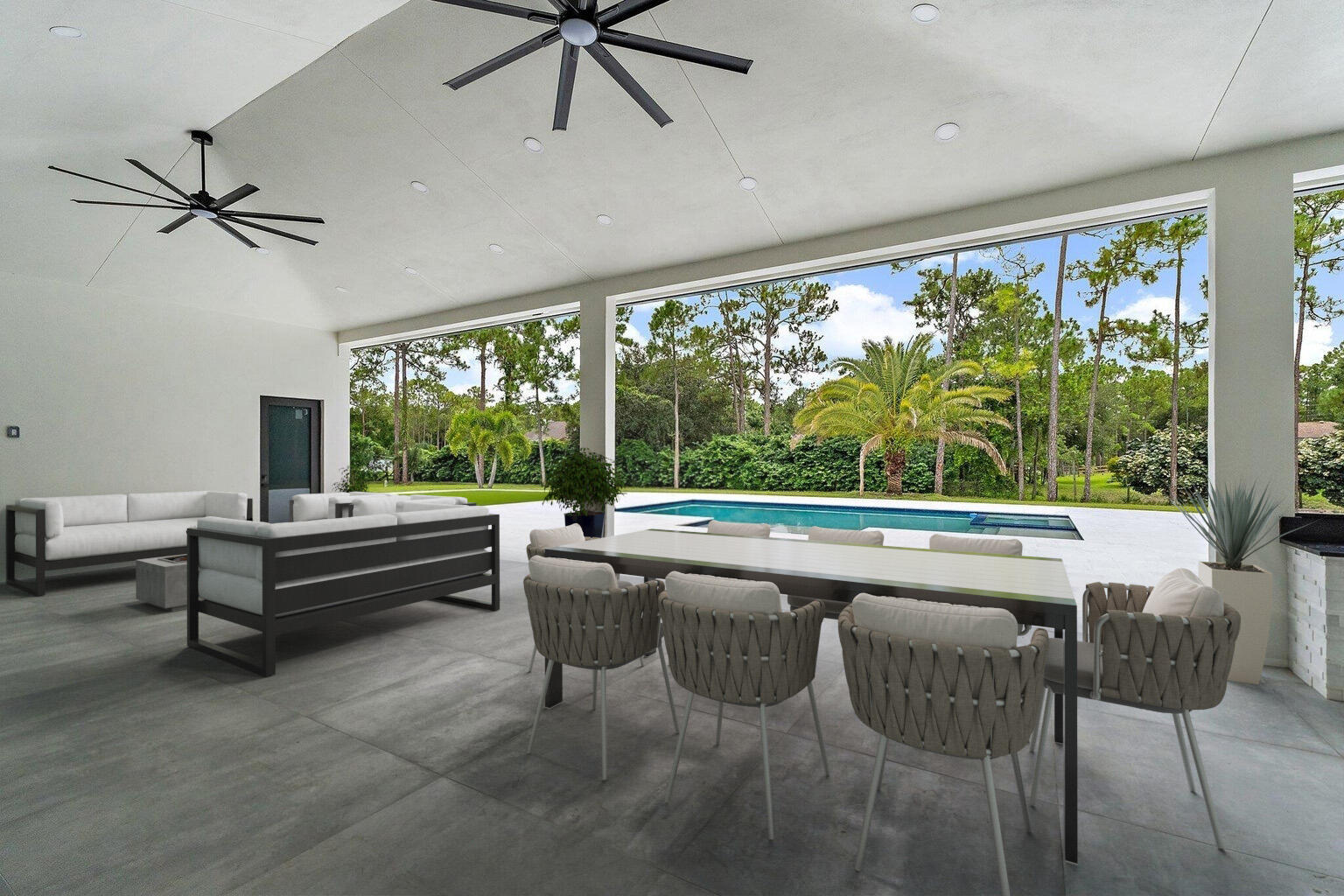 12850 152nd Street North Jupiter, FL 33478 - Photo 6 of 117 a outdoor living space with furniture and a large window