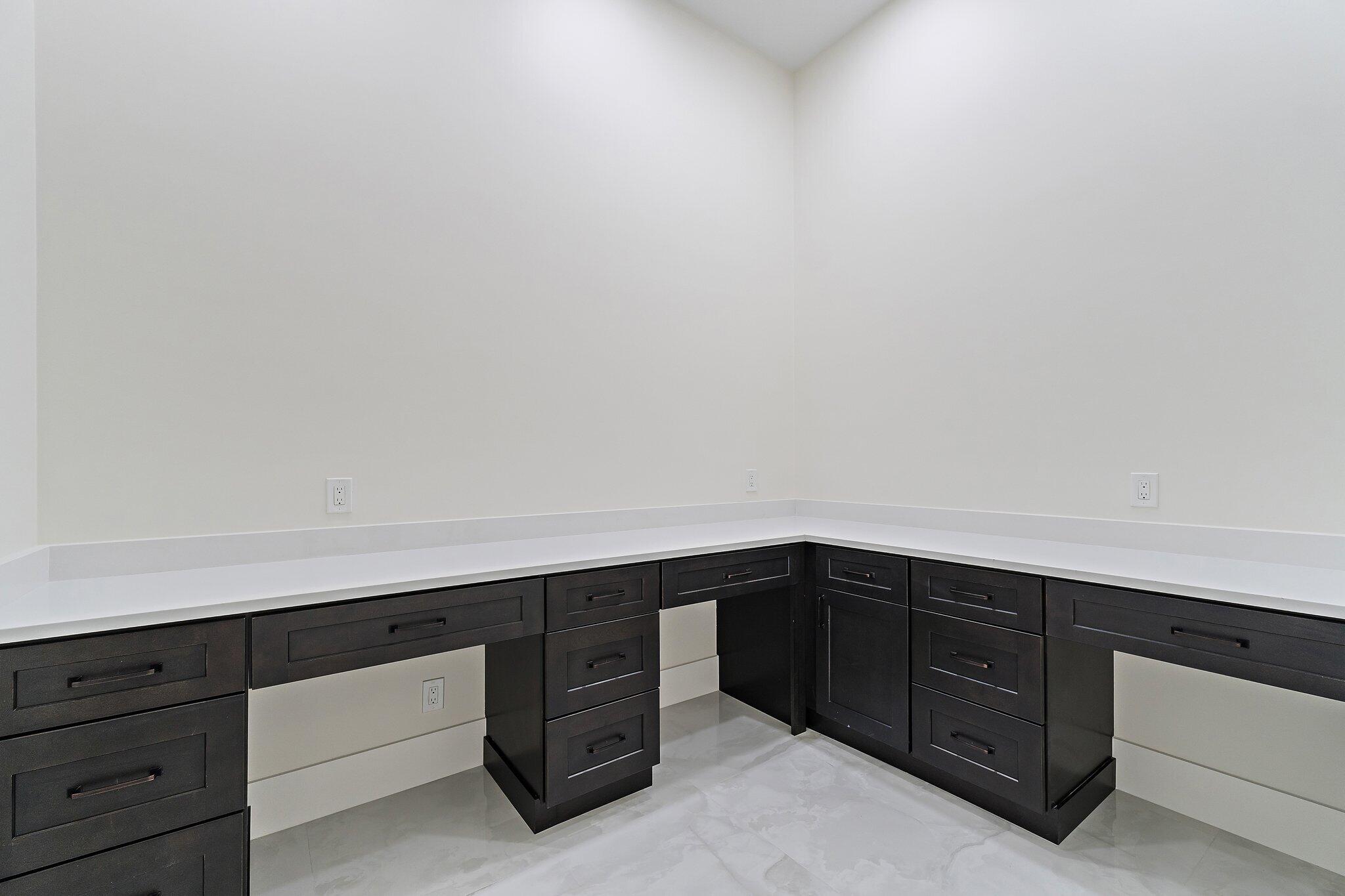 12850 152nd Street North Jupiter, FL 33478 - Photo 61 of 117 a room with a cabinets and white walls
