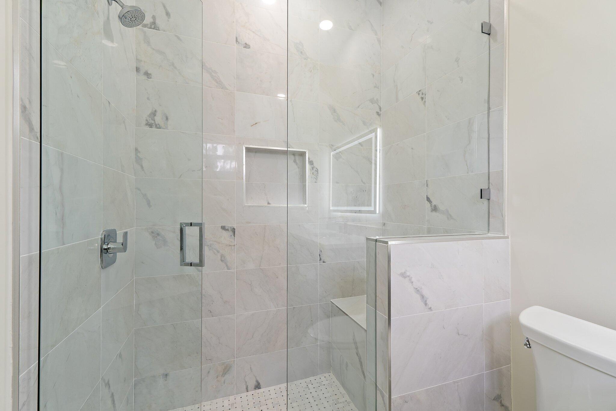 12850 152nd Street North Jupiter, FL 33478 - Photo 65 of 117 a bathroom with a shower and toilet