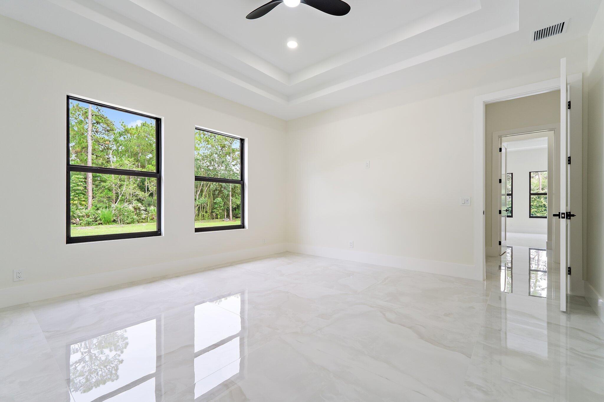 12850 152nd Street North Jupiter, FL 33478 - Photo 67 of 117 a view of an empty room with a window