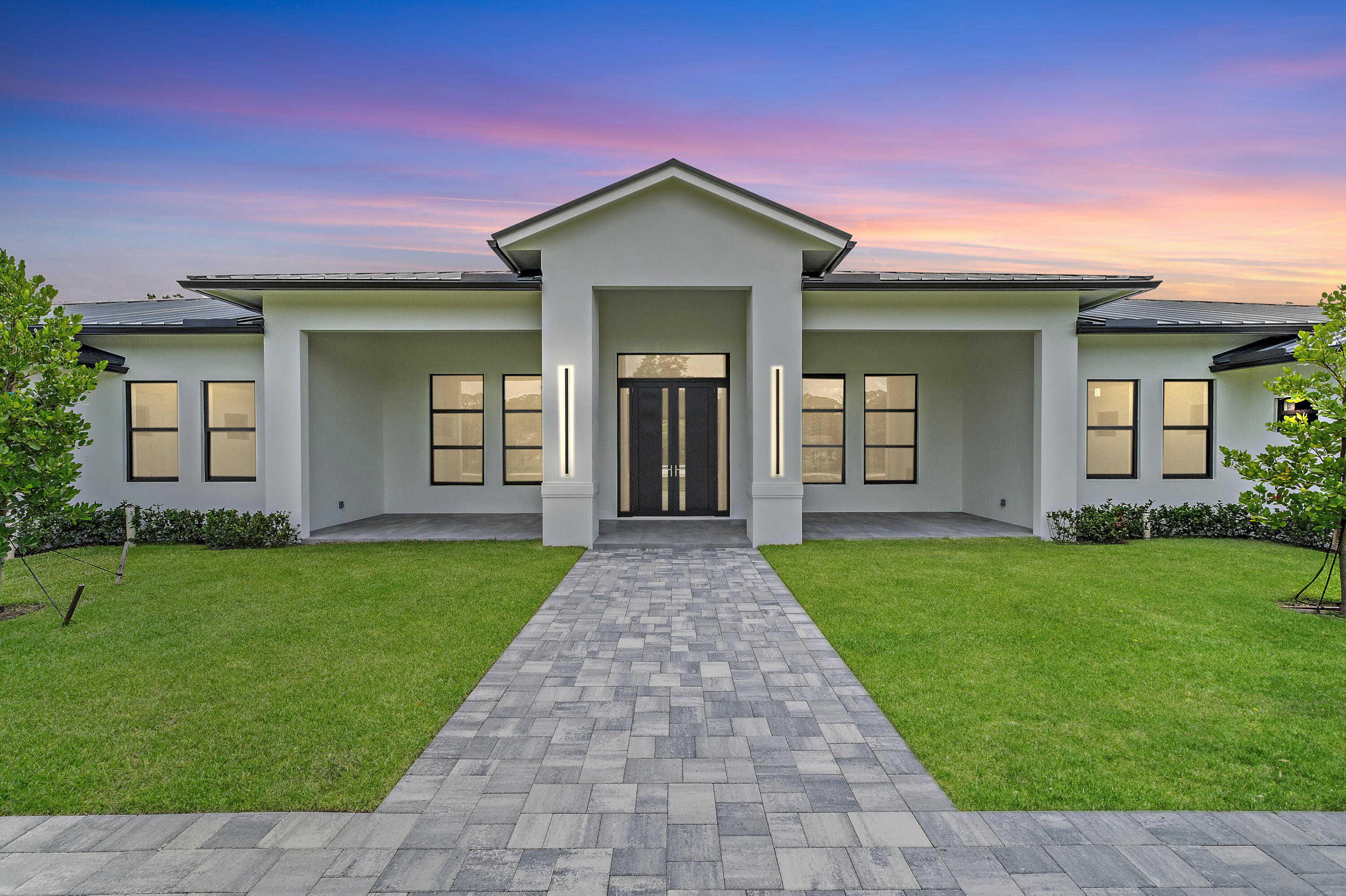 12850 152nd Street North Jupiter, FL 33478 - Photo 7 of 117 front view of a house with a yard