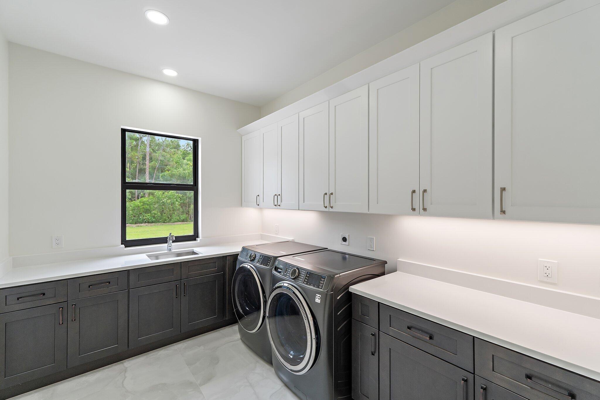 12850 152nd Street North Jupiter, FL 33478 - Photo 75 of 117 a utility room with sink dryer and washer