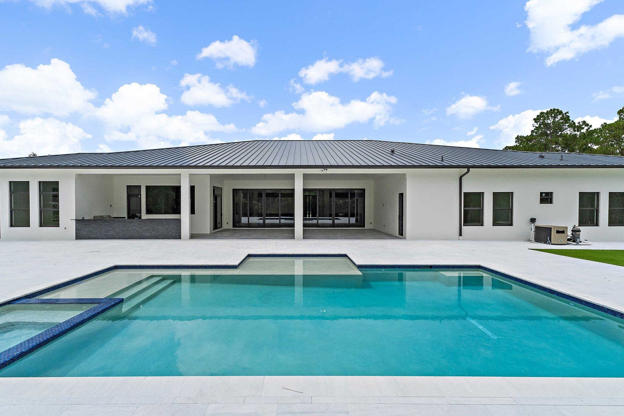 12850 152nd Street North Jupiter, FL 33478 - Photo 87 of 117 a view of a house with a backyard