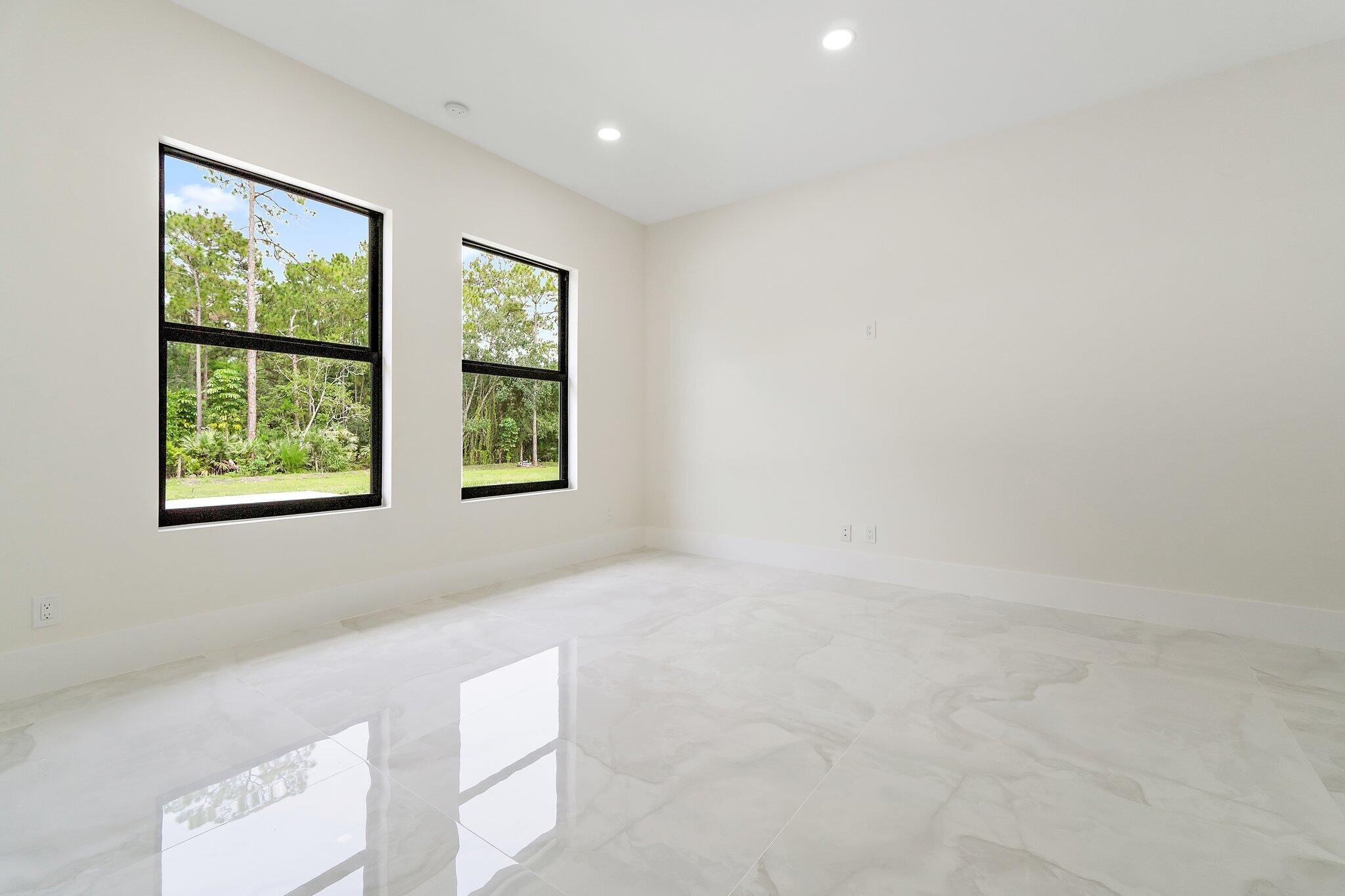 12850 152nd Street North Jupiter, FL 33478 - Photo 93 of 117 an empty room with windows