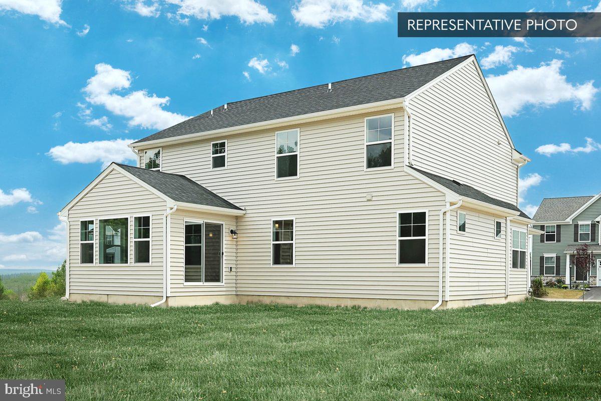 Emily Plan At The Seasons Dover, PA 17315 - Photo 4 of 27 a view of a house with a backyard