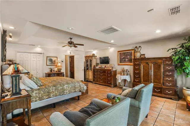 a bedroom with furniture and wooden floor