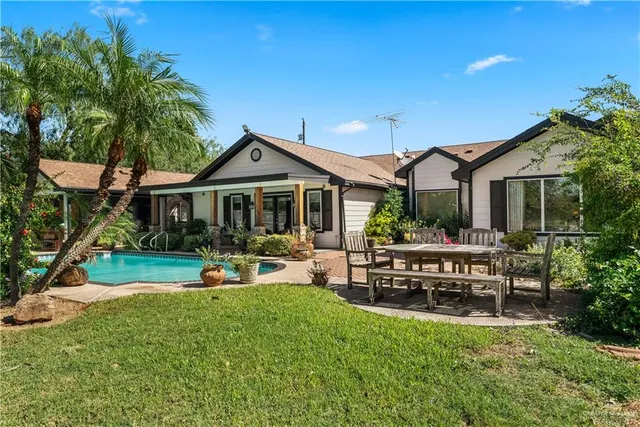 a front view of a house with garden and porch