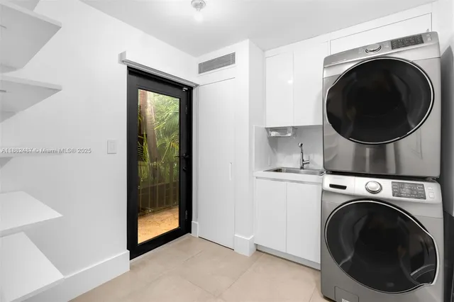a view of a hallway with washer and dryer
