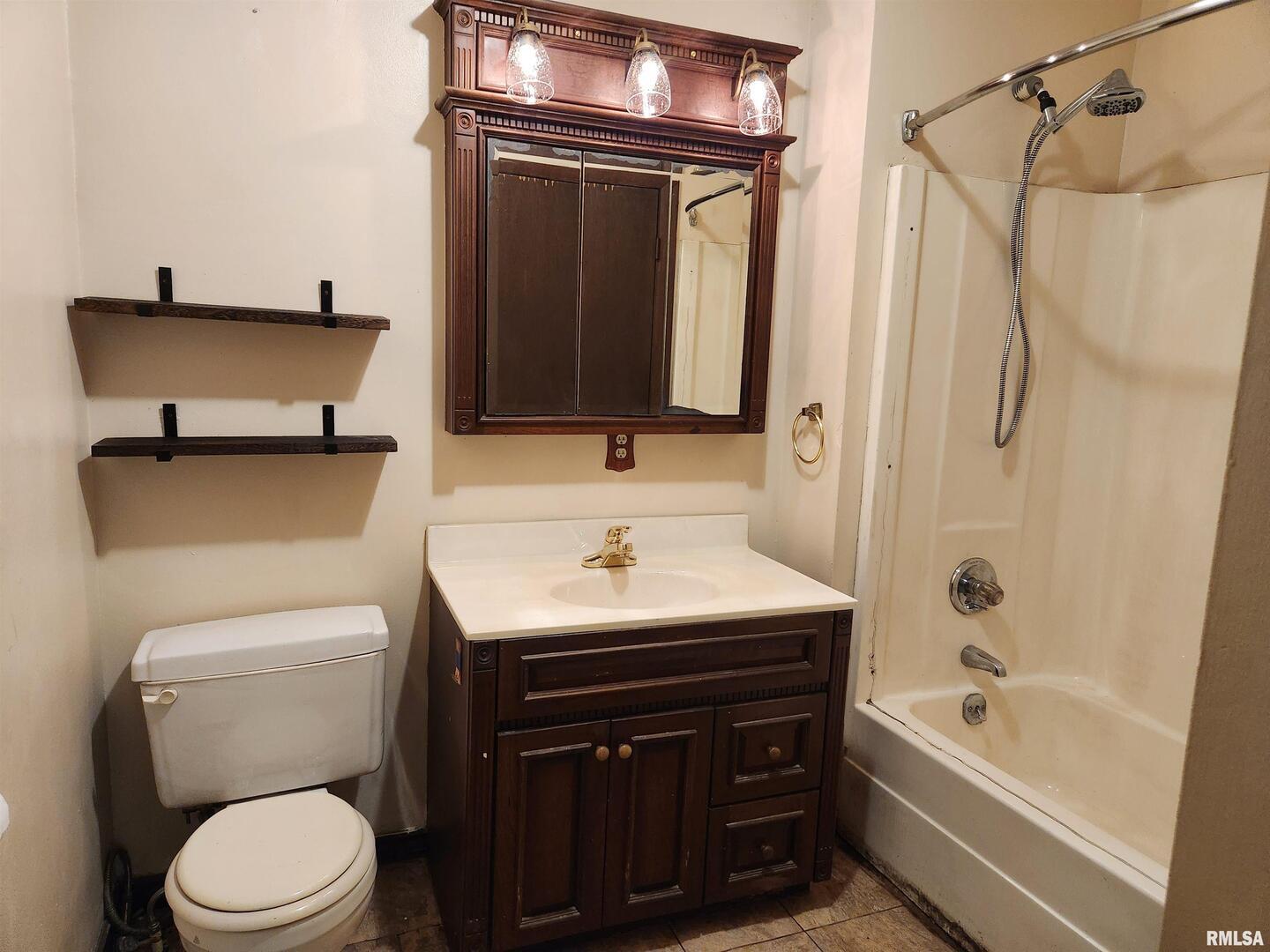 3547 Highway 148 Waltonville, IL 62894 - Photo 15 of 29 a bathroom with a sink a toilet and shower