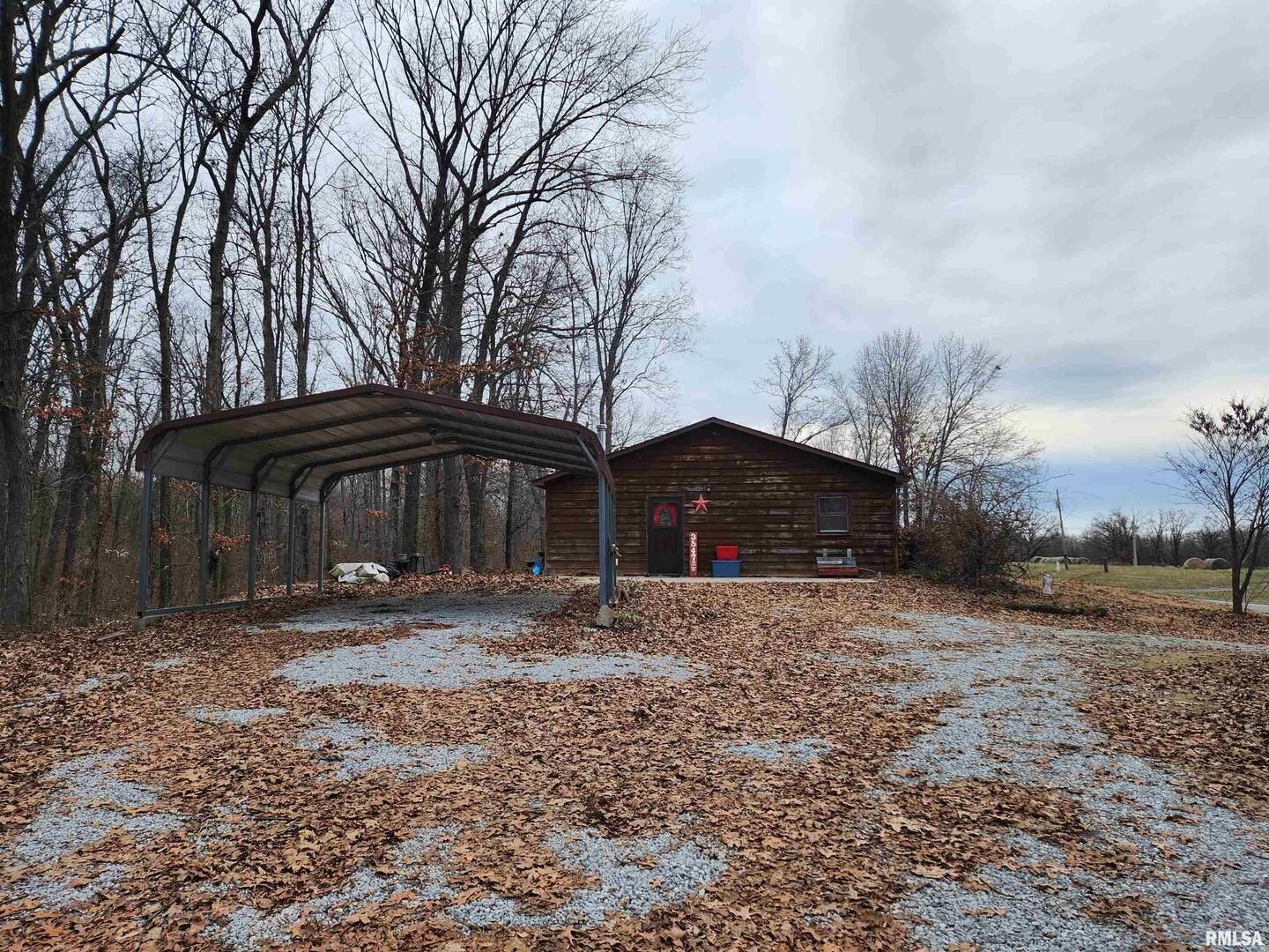 3547 Highway 148 Waltonville, IL 62894 - Photo 21 of 29 a front view of house with yard and trees