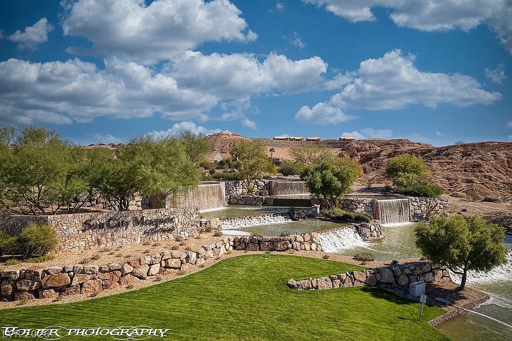 1304 Cottage Ridge Mesquite, NV 89034 - Photo 47 of 52 Cascading water features and manicured lawns enhance this vibrant community entrance.